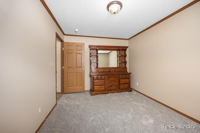 unfurnished bedroom with crown molding and carpet flooring