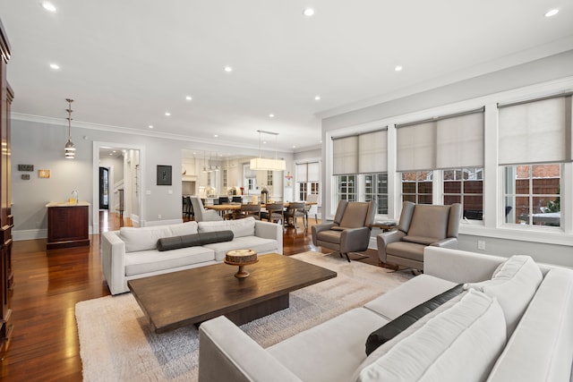 living room with baseboards, recessed lighting, dark wood finished floors, and crown molding