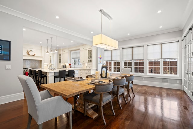 dining space featuring recessed lighting, visible vents, baseboards, ornamental molding, and dark wood finished floors