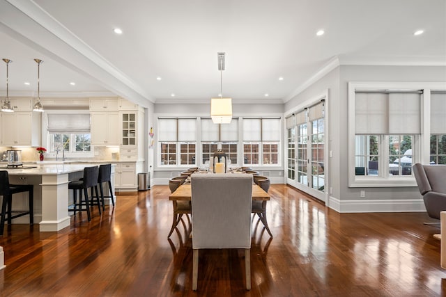 dining room featuring ornamental molding, dark wood-type flooring, recessed lighting, and baseboards