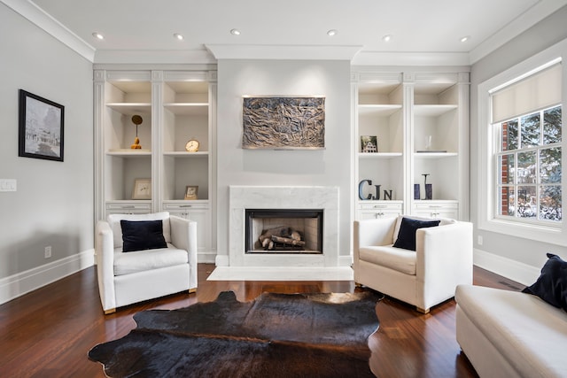 living area with baseboards, dark wood-style floors, and built in features