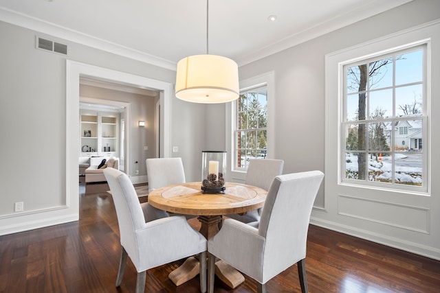 dining room featuring dark wood-style floors, visible vents, and a healthy amount of sunlight