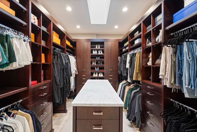 walk in closet with a skylight