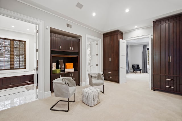 sitting room with vaulted ceiling, recessed lighting, visible vents, and light colored carpet