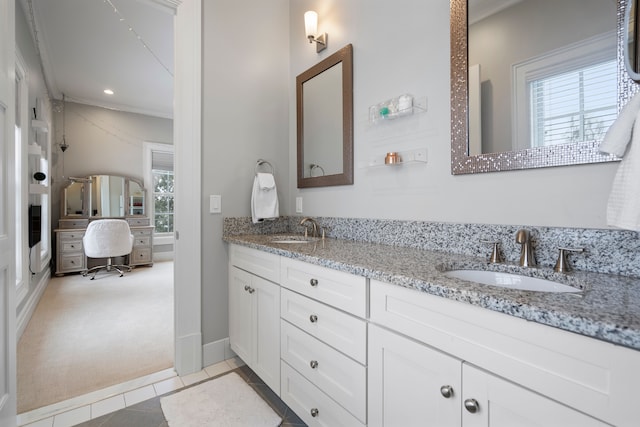 bathroom with double vanity, recessed lighting, a sink, and tile patterned floors