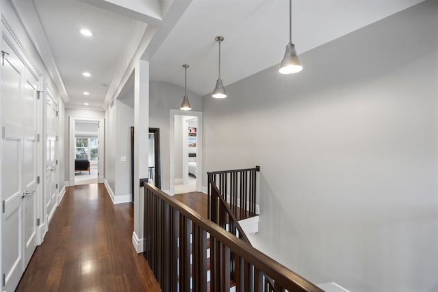 hall with recessed lighting, an upstairs landing, baseboards, ornamental molding, and dark wood-style floors