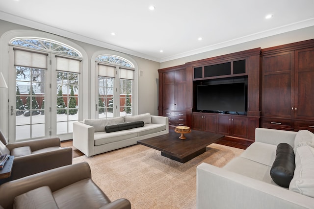 living room with light wood-style floors, ornamental molding, and recessed lighting