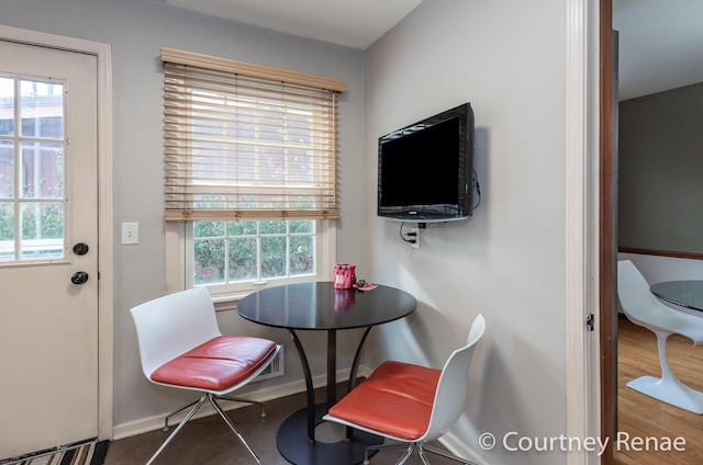 dining area with hardwood / wood-style floors