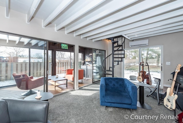 living room featuring beam ceiling and a wall unit AC