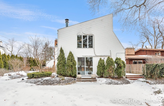 view of snow covered house