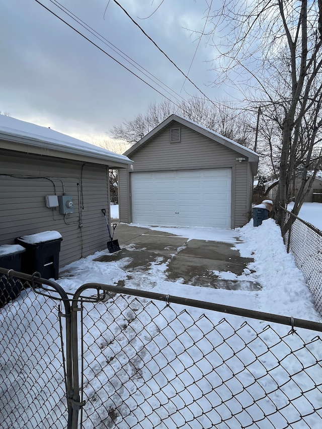 view of snow covered garage