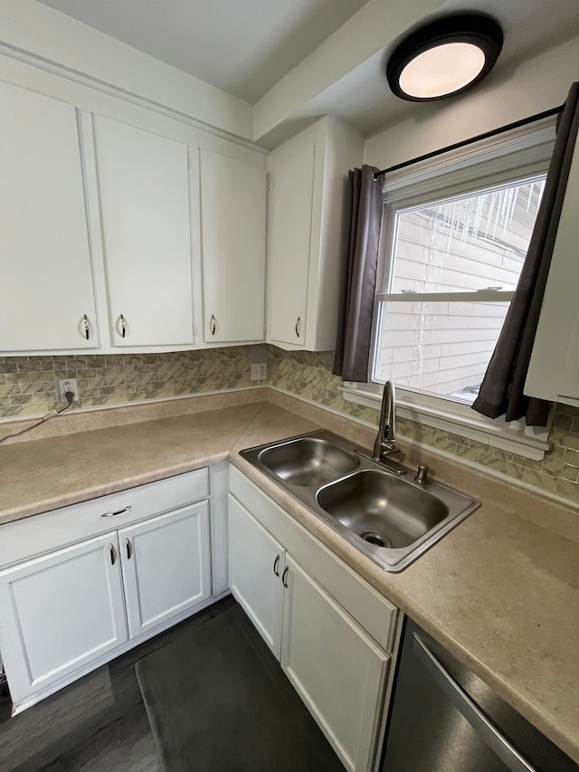 kitchen with sink, white cabinetry, decorative backsplash, and dishwasher