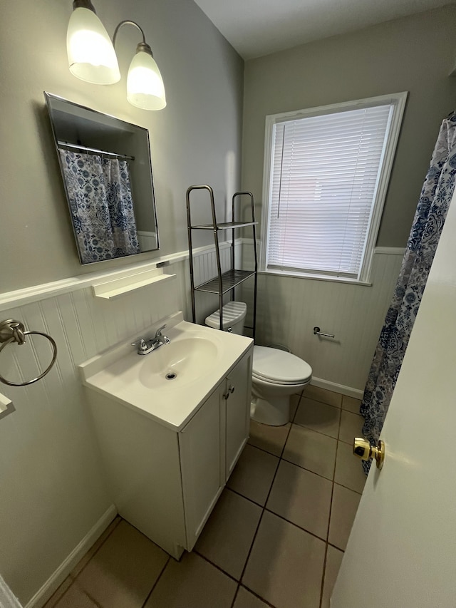 bathroom with tile patterned floors, toilet, and vanity