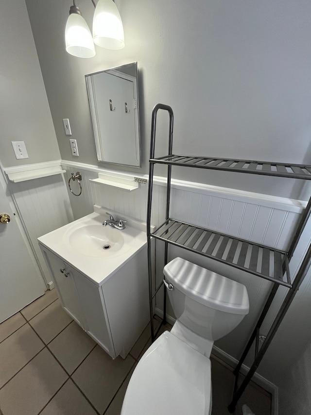 bathroom with tile patterned floors, toilet, and vanity