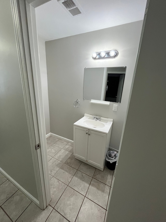 bathroom featuring tile patterned floors and vanity