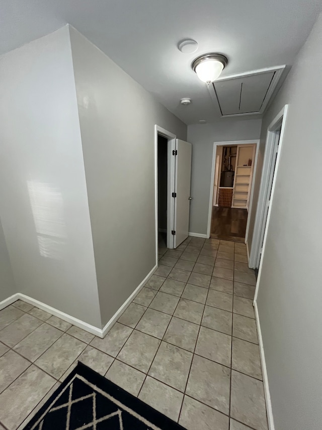 hallway with light tile patterned flooring