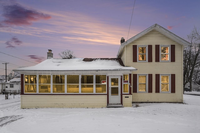 view of snow covered property