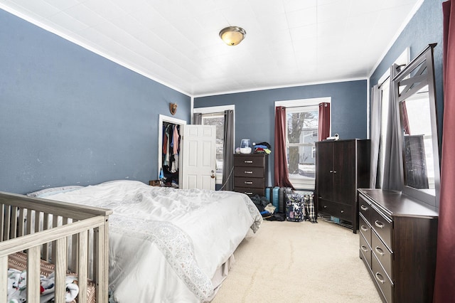 carpeted bedroom with ornamental molding