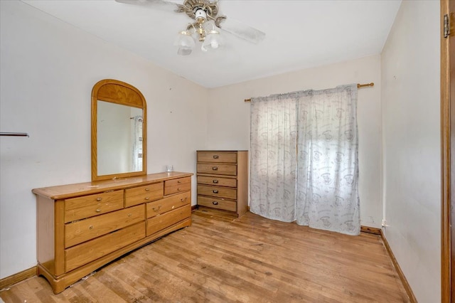 bedroom featuring light hardwood / wood-style flooring and ceiling fan