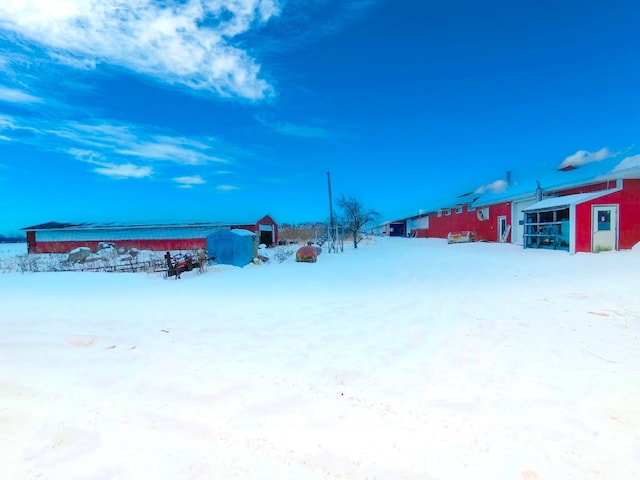 view of yard covered in snow