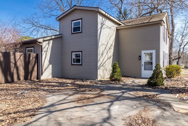 view of property exterior featuring fence