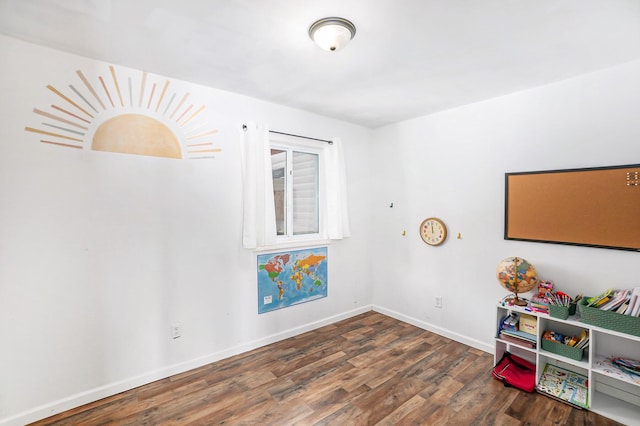 game room featuring dark hardwood / wood-style floors