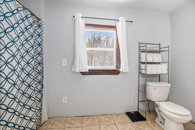 bathroom featuring tile patterned flooring and toilet
