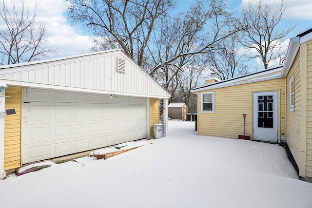 view of snow covered garage