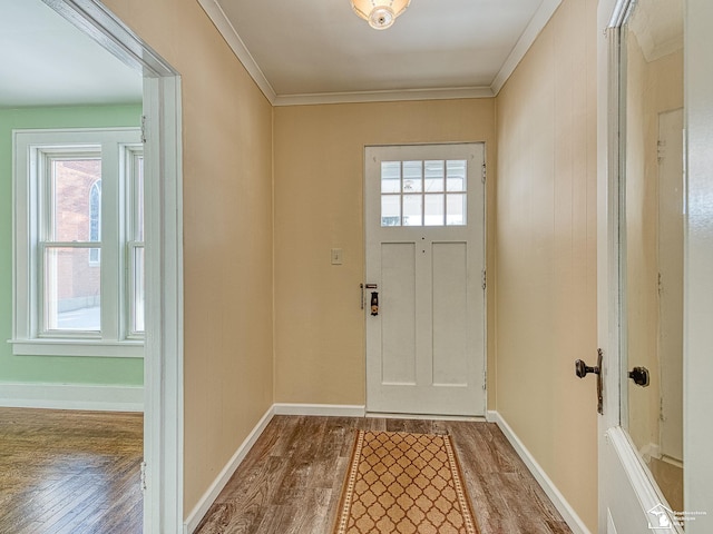 doorway featuring wood-type flooring and ornamental molding