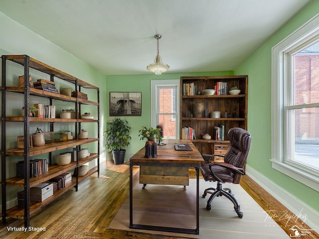 office space featuring hardwood / wood-style flooring and a healthy amount of sunlight