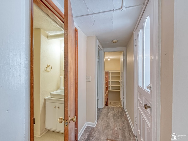 hall with light wood-type flooring