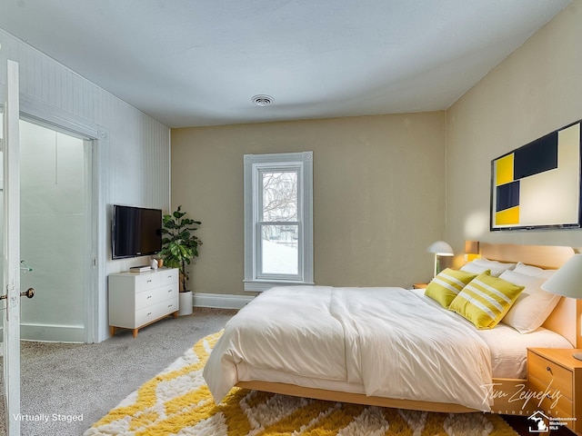 bedroom featuring light carpet