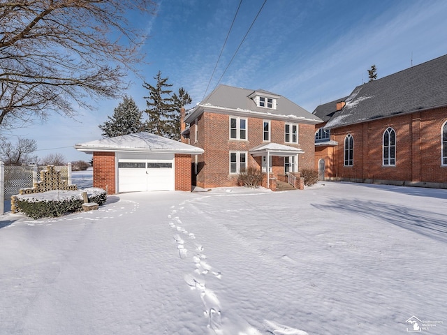 view of front of home with an outbuilding and a garage