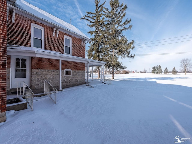 view of yard covered in snow