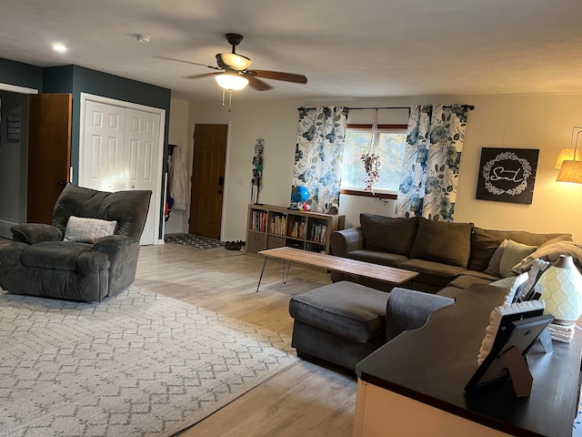 living room featuring hardwood / wood-style flooring and ceiling fan