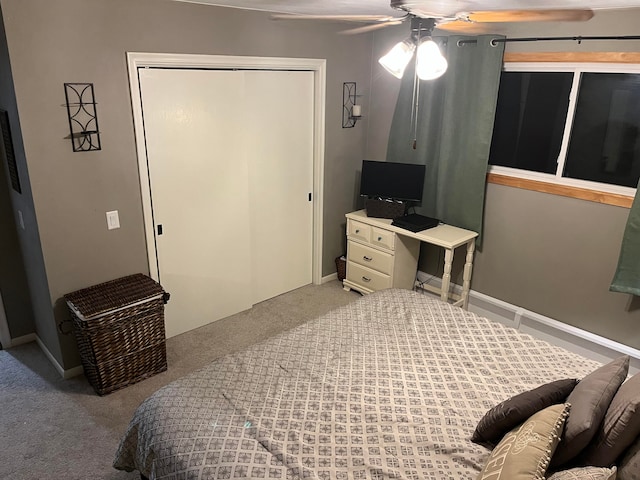 carpeted bedroom featuring a closet and ceiling fan