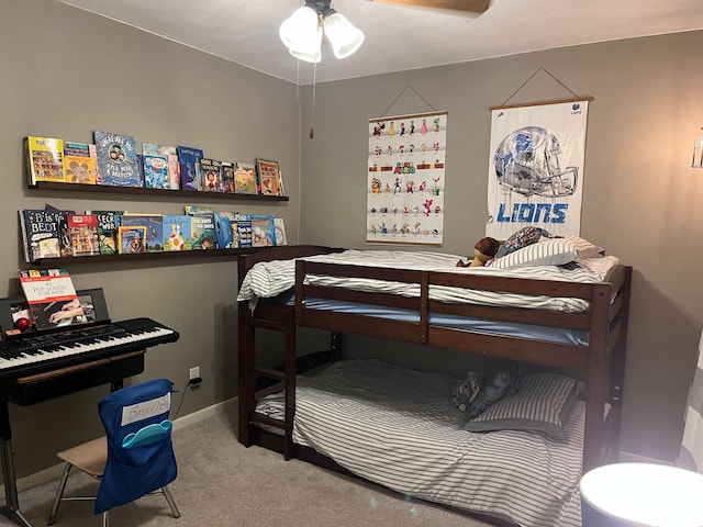 bedroom with ceiling fan and carpet flooring