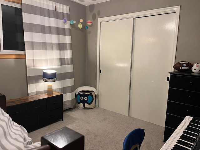 carpeted bedroom with a closet