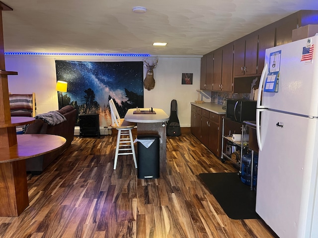 dining space featuring dark hardwood / wood-style floors