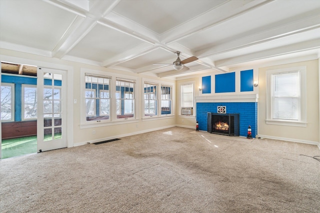 unfurnished living room featuring carpet, coffered ceiling, beam ceiling, and a brick fireplace