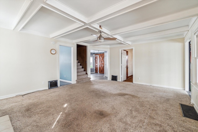 empty room featuring beamed ceiling, ceiling fan, coffered ceiling, and carpet