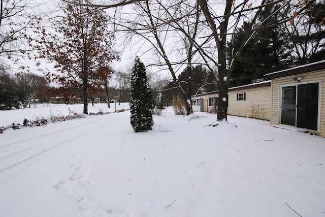 view of yard covered in snow