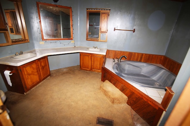 bathroom with vanity and a bathing tub