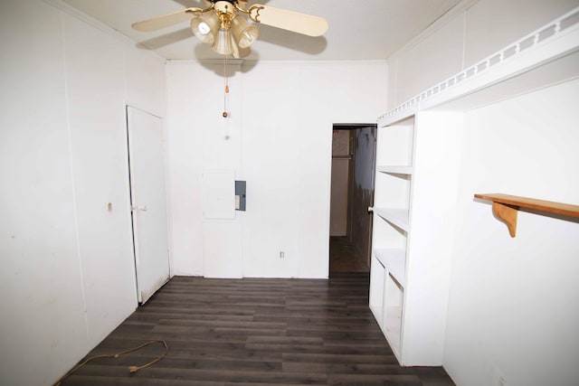 spare room featuring ceiling fan, ornamental molding, and dark hardwood / wood-style floors