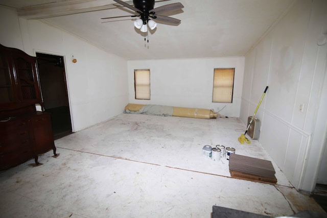 spare room featuring ceiling fan and vaulted ceiling