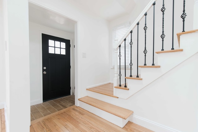 entryway with wood-type flooring