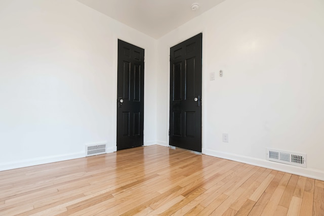 unfurnished room featuring light wood-type flooring