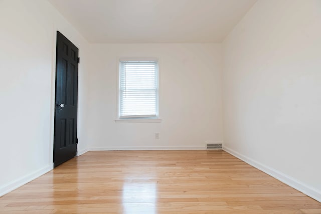 empty room with light wood-type flooring