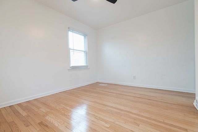 spare room featuring ceiling fan and light wood-type flooring