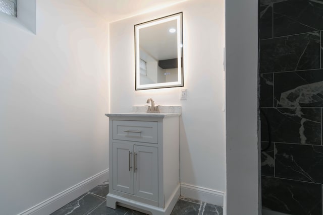 bathroom with vanity and a shower